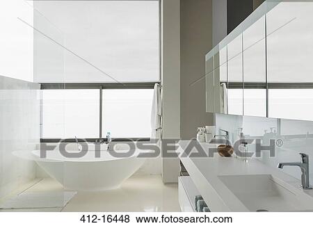 Soaking tub in modern bathroom View Large Photo Image Stock Photo - Soaking tub in modern bathroom. Fotosearch