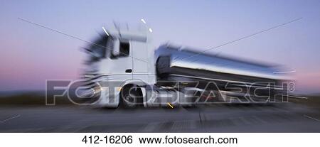 Stainless steel milk tanker on the road at night View Large Photo Image Stock Photograph - Stainless steel milk tanker on the road at night. Fotosearch