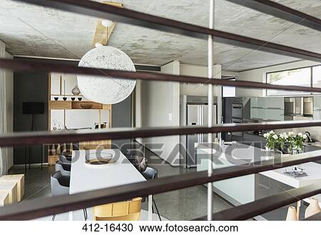 View of modern dining room and kitchen through wood slats View Large Photo Image Stock Image - View of modern dining room and kitchen through wood slats. Fotosearch