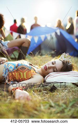 Woman in tiara sleeping outside tent at music festival View Large Photo Image Stock Image - Woman in tiara sleeping outside tent at music festival. Fotosearch