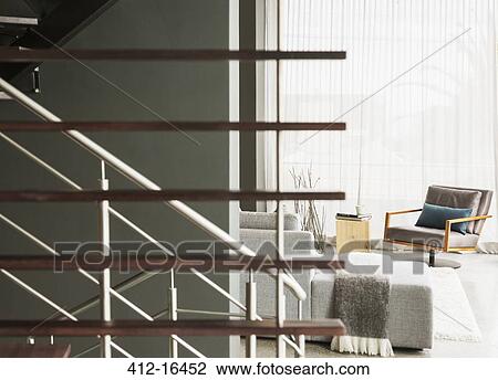 Stock Image - Wood slats along modern staircase. Fotosearch