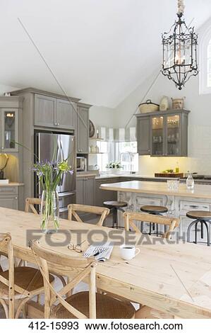 Wooden dining table in luxury kitchen View Large Photo Image Stock Image - Wooden dining table in luxury kitchen. Fotosearch
