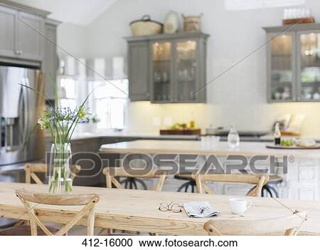 Wooden table in luxury kitchen View Large Photo Image Stock Image - Wooden table in luxury kitchen. Fotosearch