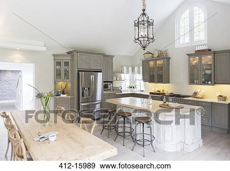 Stock Photo - Wooden table in luxury kitchen. Fotosearch