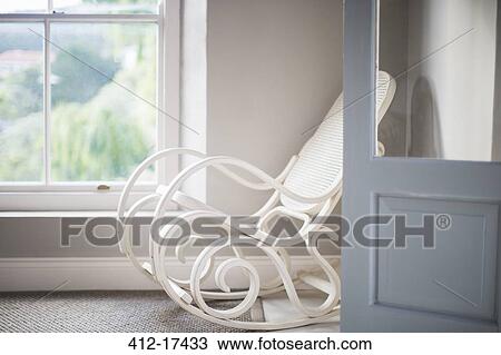 Antique rocking chair in corner View Large Photo Image Stock Image - Antique rocking chair in corner. Fotosearch