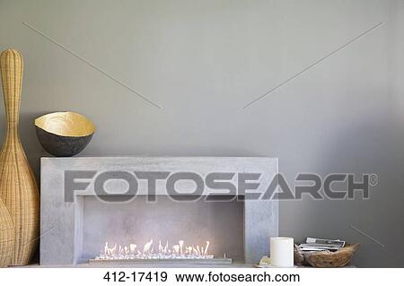 Apple art above fireplace in modern living room View Large Photo Image Stock Photo - Apple art above fireplace in modern living room. Fotosearch