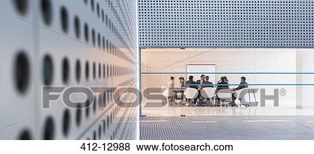 Business people at conference room in modern building View Large Photo Image Stock Photo - Business people at conference room in modern building. Fotosearch