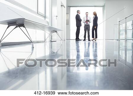 Business people in corridor View Large Photo Image Stock Photo - Business people in corridor. Fotosearch