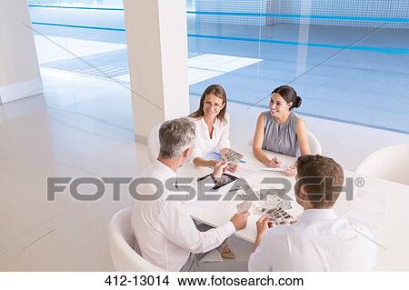 Picture - Business people meeting at conference table. Fotosearch