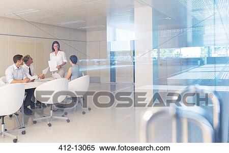 Stock Photography - Business people meeting in conference room. Fotosearch