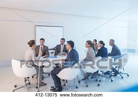 Stock Photography - Business people meeting in conference room. Fotosearch