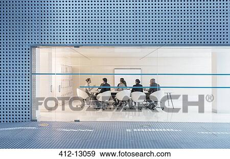 Stock Photo - Business people meeting in modern conference room. Fotosearch