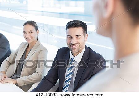 Business people meeting in office View Large Photo Image Stock Image - Business people meeting in office. Fotosearch