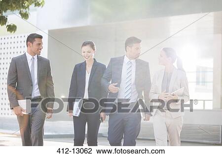 Business people talking outdoors View Large Photo Image Stock Image - Business people talking outdoors. Fotosearch