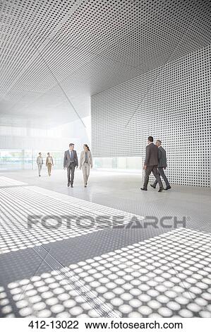 Business people walking outside modern building View Large Photo Image Stock Image - Business people walking outside modern building. Fotosearch