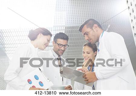 Doctors consulting in hospital View Large Photo Image Stock Image - Doctors consulting in hospital. Fotosearch