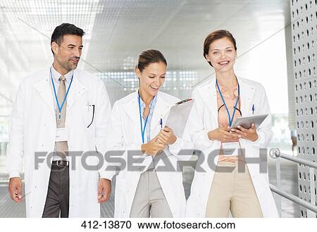 Doctors in hospital corridor View Large Photo Image Stock Image - Doctors in hospital corridor. Fotosearch