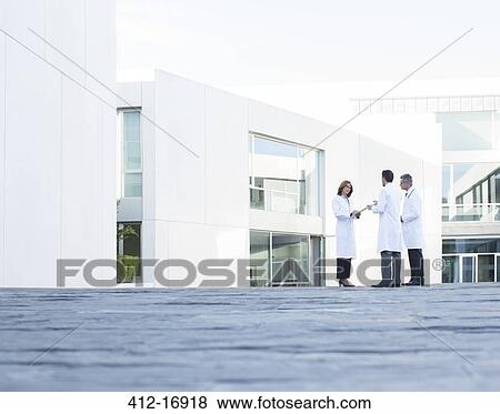 Doctors talking on rooftop View Large Photo Image Stock Photo - Doctors talking on rooftop. Fotosearch