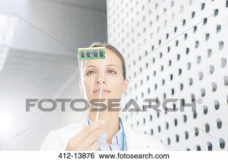 Engineer examining circuit board View Large Photo Image Stock Photograph - Engineer examining circuit board. Fotosearch