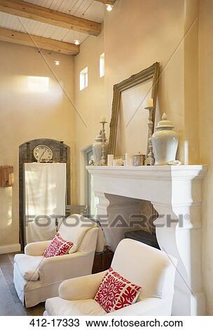 Stock Image - Fireplace with mantel in luxury living room. Fotosearch
