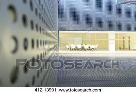 Illuminated conference room in modern building at night View Large Photo Image Stock Image - Illuminated conference room in modern building at night. Fotosearch