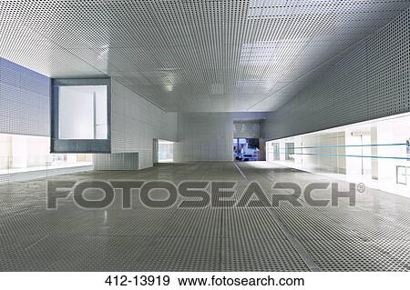 Stock Photo - Illuminated windows of modern office building. Fotosearch