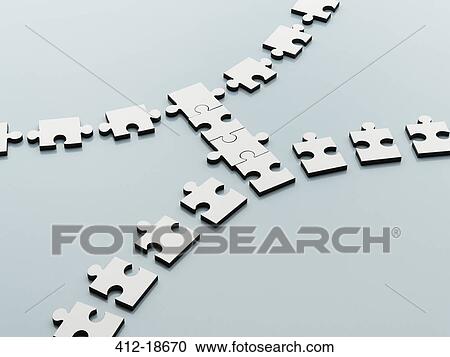 Stock Image - Jigsaw pieces bridging the gap. Fotosearch