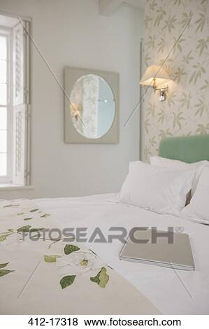 Laptop on luxury bed View Large Photo Image Stock Photo - Laptop on luxury bed. Fotosearch