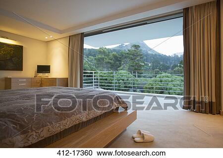 Luxury bedroom with mountain view View Large Photo Image Stock Image - Luxury bedroom with mountain view. Fotosearch