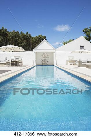 Luxury house and lap pool View Large Photo Image Stock Photograph - Luxury house and lap pool. Fotosearch