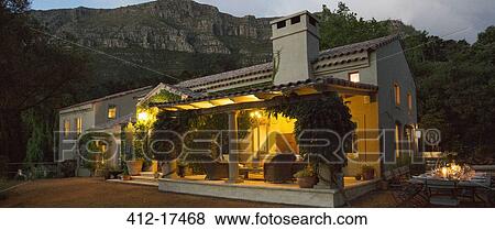 Luxury villa illuminated at night View Large Photo Image Stock Photo - Luxury villa illuminated at night. Fotosearch