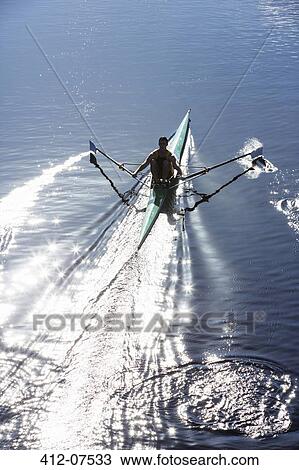 Man rowing scull on lake View Large Photo Image Stock Image - Man rowing scull on lake. Fotosearch