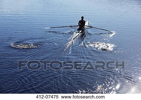 Man rowing scull on lake View Large Photo Image Stock Photography - Man rowing scull on lake. Fotosearch
