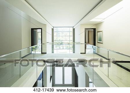 Modern balcony and open foyer in luxury home View Large Photo Image Stock Photo - Modern balcony and open foyer in luxury home. Fotosearch