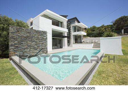Modern house and lap pool View Large Photo Image Stock Photo - Modern house and lap pool. Fotosearch