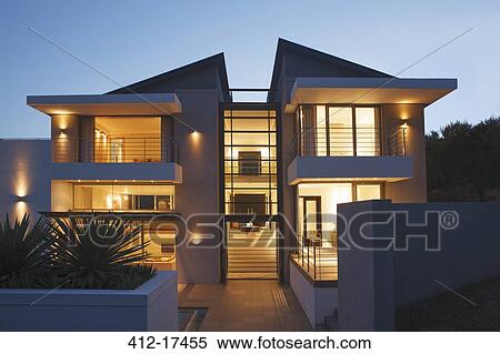 Modern house illuminated at night View Large Photo Image Stock Photography - Modern house illuminated at night. Fotosearch