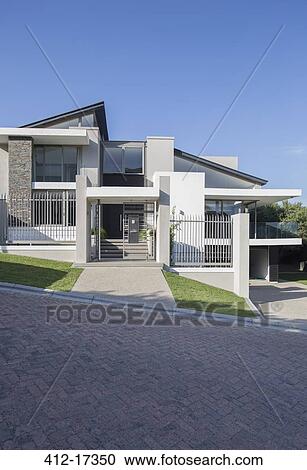 Modern house under blue sky View Large Photo Image Stock Image - Modern house under blue sky. Fotosearch