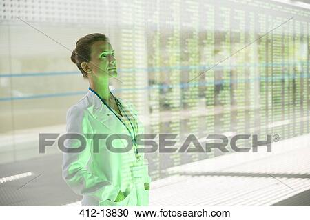 Pensive doctor in hospital corridor View Large Photo Image Stock Image - Pensive doctor in hospital corridor. Fotosearch