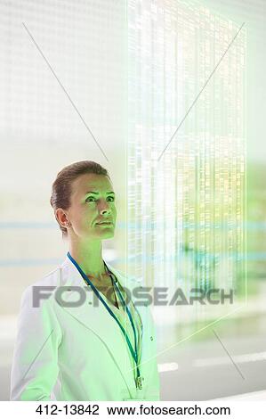 Pensive doctor in hospital corridor View Large Photo Image Stock Image - Pensive doctor in hospital corridor. Fotosearch