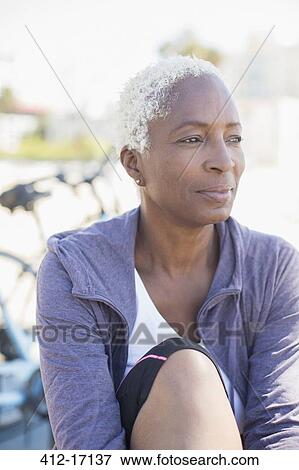 Stock Photo - Pensive woman looking away. Fotosearch