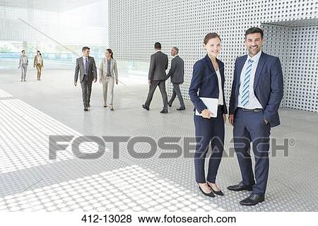 Portrait of business people outside modern building View Large Photo Image Stock Photo - Portrait of business people outside modern building. Fotosearch