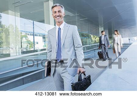 Stock Image - Portrait of businessman leaving office. Fotosearch