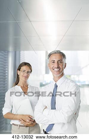 Stock Image - Portrait of confident business people. Fotosearch