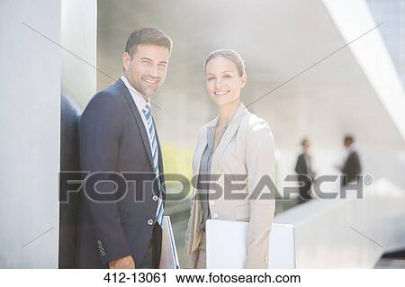 Stock Image - Portrait of confident business people outdoors. Fotosearch