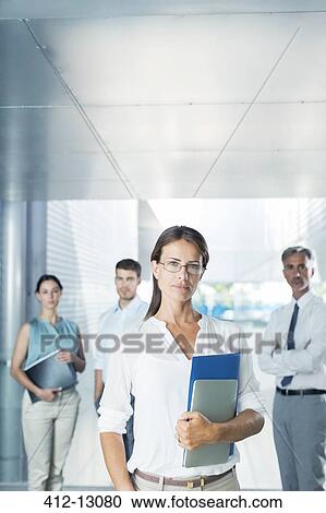 Portrait of confident business people in office View Large Photo Image Stock Image - Portrait of confident business people in office. Fotosearch
