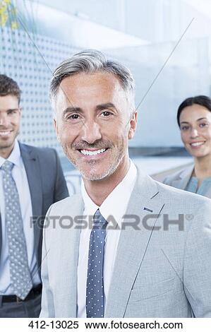 Portrait of confident business people outdoors View Large Photo Image Stock Photography - Portrait of confident business people outdoors. Fotosearch
