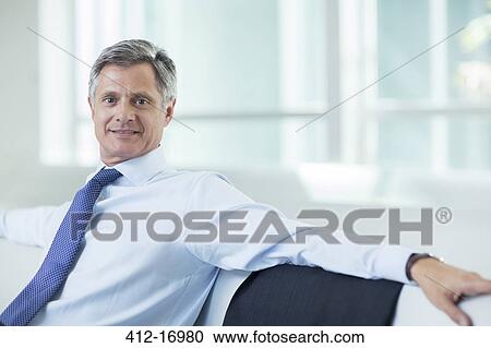 Stock Image - Portrait of confident businessman. Fotosearch