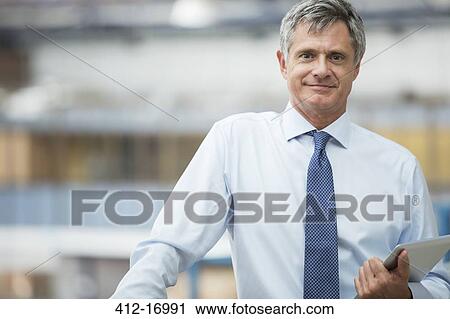 Portrait of confident businessman View Large Photo Image Stock Image - Portrait of confident businessman. Fotosearch