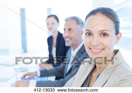 Portrait of confident businesswoman in meeting View Large Photo Image Stock Image - Portrait of confident businesswoman in meeting. Fotosearch