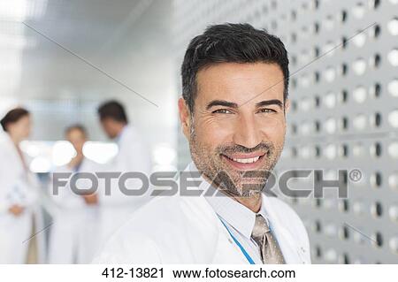 Portrait of confident doctor View Large Photo Image Stock Image - Portrait of confident doctor. Fotosearch